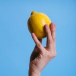 person holding lemon