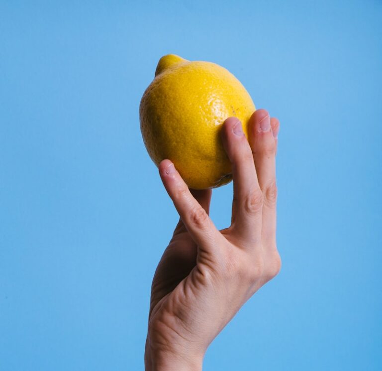 person holding lemon